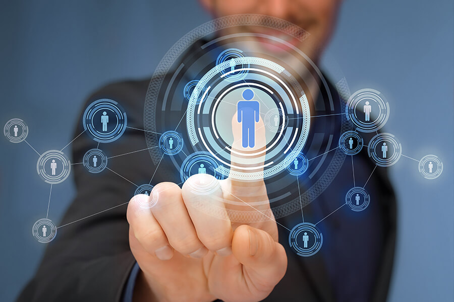 DotClick: Hand interacting with a futuristic digital interface showing a central user icon connected to a network of other user icons, symbolizing connection or networking.